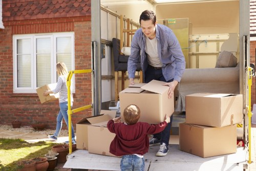 Moving company team loading furniture into a van