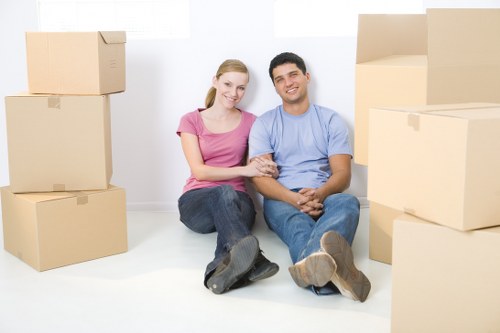 Office relocation team moving desks and equipment in London