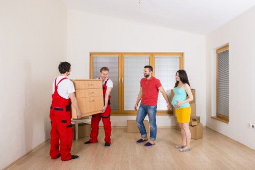 Removal staff planning a house move booking