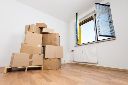 Local removal truck loading boxes and furniture for a London customer