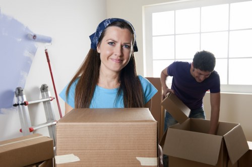 Careful loading by a London moving team in a busy street