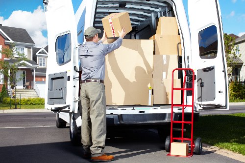 Household and office furniture being loaded for collection in London