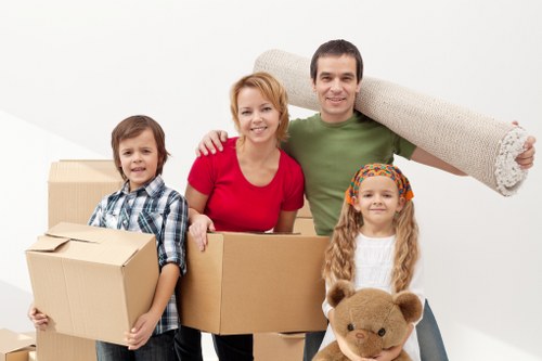 Trained movers handling furniture safely in a London move