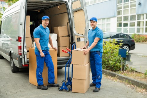 Packed moving boxes and protective wrapping ready for a London house move