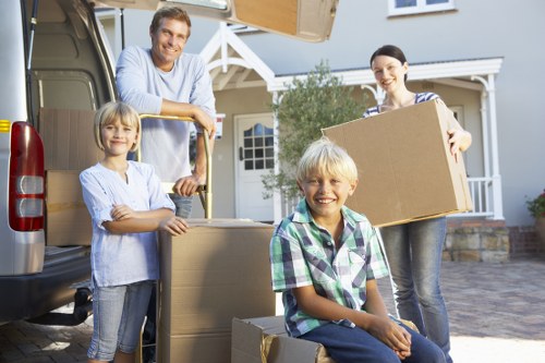 Loading household items into a van for a London removal