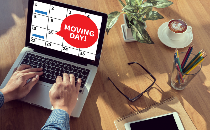 Office relocation scene with movers handling equipment in London